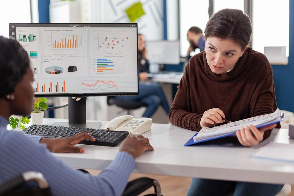 businesswomen-planning-financial-strategy-looking-computer-working-together-start-up-company-officet_482257-2082